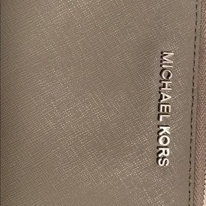 Grey Michael Kors wallet puff ball key chain